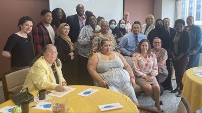 FUiE program participants pose with Cocco De Filippis, family members, classmates, and Hostos senior management during the FUiE Celebration Luncheon.