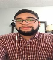 a person wearing glasses taking a selfie