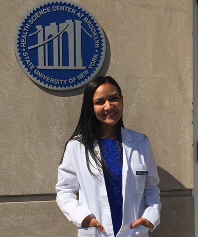 Arlene Castillo donning a white medical coat